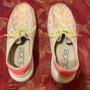 Hey Dudes ladies size 9 men’s 7. Tan animal print with pink and lime green ties.